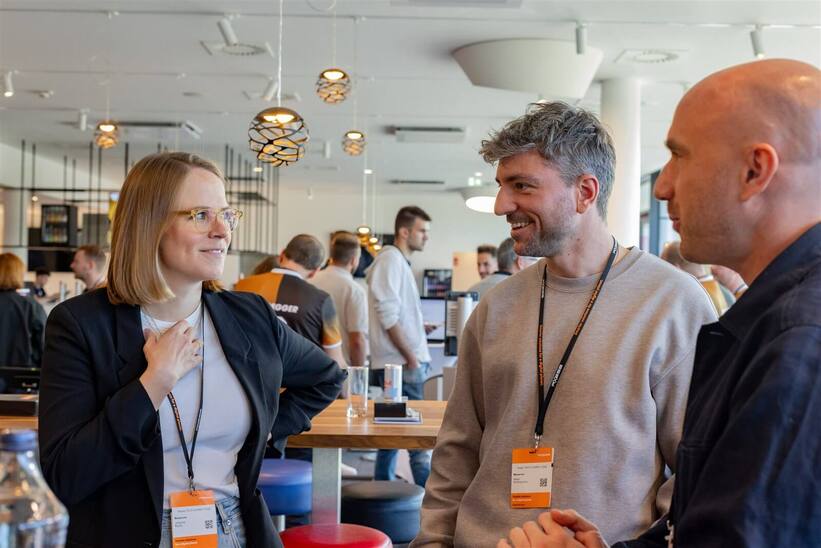 Guests networking in the lounge at the Axess Tech Summit 2026